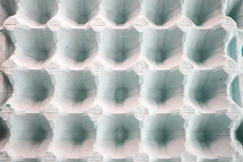 Top view of an empty cardboard egg tray. Background texture of a container made Stock Photos