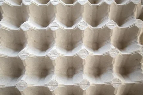 Top view of an empty cardboard egg tray. Background texture of a container made Stock Photos