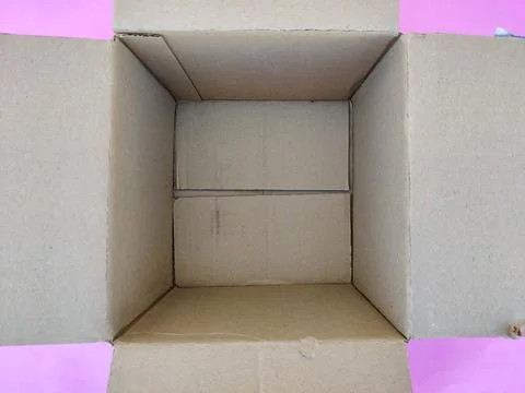 Top view of empty cart board box or brown box isolated on pink background Stock Photos