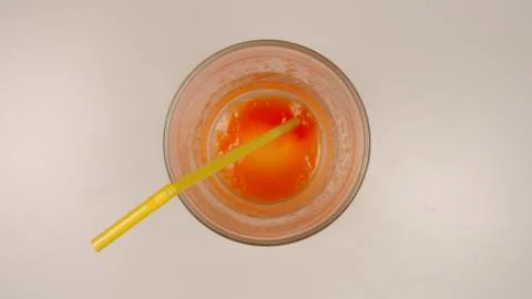 TOP VIEW: Empty glass with a straw after tomato juice Stock Photos