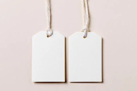 Top view empty labels arrangement beige background. High quality and resolution Stock Photos