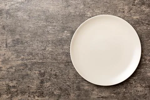 Top view of empty light plate on cement background. Empty space for your desi Stock Photos