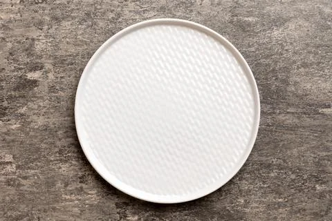 Top view of empty light plate on cement background. Empty space for your desi Stock Photos