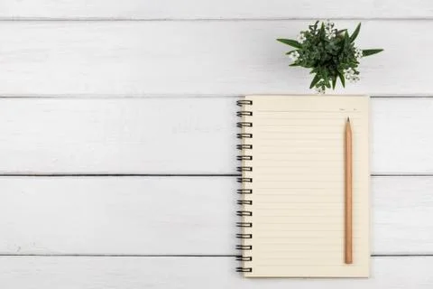 Top view of empty line paper notebook on white wooden background Stock Photos