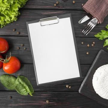 Top view empty menu with tomatoes spinach Stock Photos