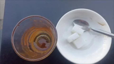 Top View of Empty Moroccan Tea Glass with Sugar Cubes Stock Footage 341671048