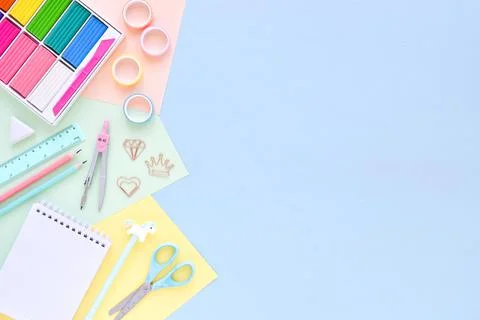 Top view of an empty office desk with an empty space on a pastel background.  Stock Photos