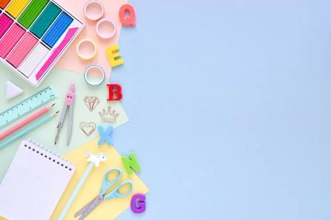 Top view of an empty office desk with an empty space on a pastel background.  Stock Photos