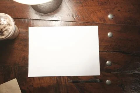 Top view empty paper on old wood table vintage style Fotos Stock