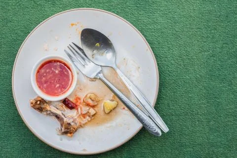 Top view of empty plate, dirty after the meal is finished on tablet with copy Stock Photos