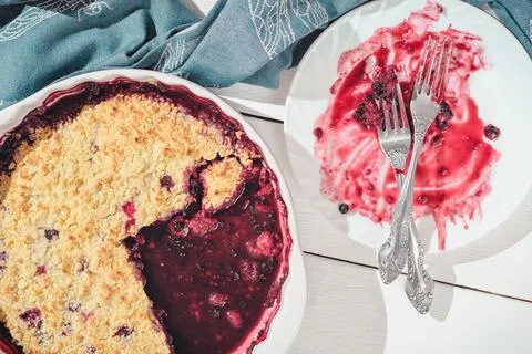 Top view of an empty plate with forks on it after pie. part of a crumble be.. Stock Photos