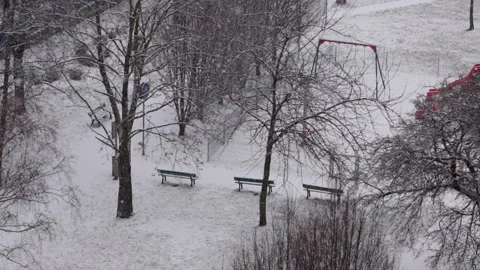 Top view of empty Playground and winter Park paths are covered with snow Stock Footage 232156411