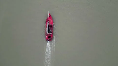 Top view of an empty red bulkhead ship moving forward through the water Stock Footage 287783485