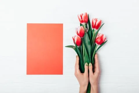 Top view empty red paper card and bouquet Stock Photos