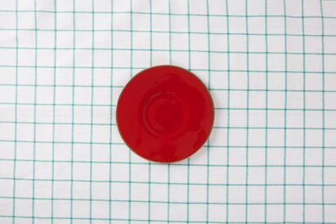 Top view of empty red plate put on cloth table with space for copy. Stock Photos