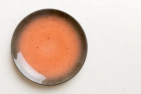 Top view of empty red plate on cement background. Empty space for your design Stock Photos