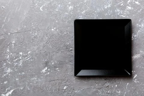 Top view of empty square plate on cement background. Empty space for your des Foto stock