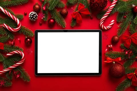 Top view of empty tablet on Christmas background made of new year decorand fe Stock Photos