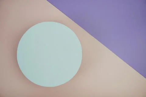 Top view of empty white cirle on pink and purple geometric background Stock Photos