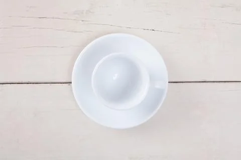 Top view of empty white cup coffee put on white wood table with space for cop Stock Photos