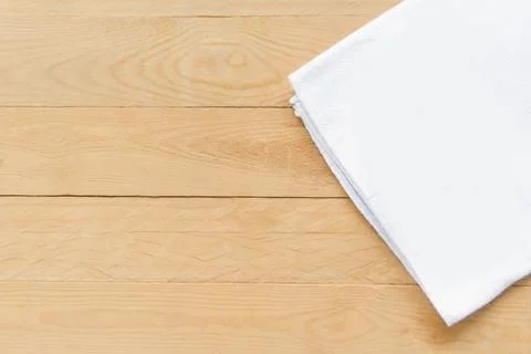 Top view empty white fabric on wooden table with copy space Stock Photos