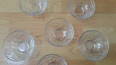 Top view of empty white glass bowls on a wooden floor Stock Photos