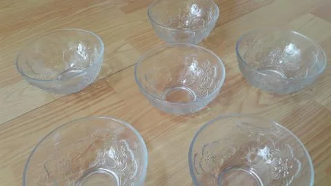 Top view of empty white glass bowls on a wooden floor Stock Photos