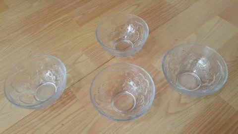 Top view of empty white glass bowls on a wooden floor Stock Photos