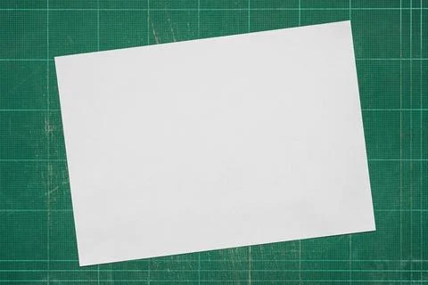 Top view of empty white paper A4 size on old grunge green dirty cutting mat, Stock Photos