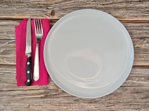 Top view of an empty white plate on a table Stock Photos