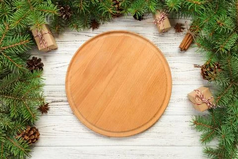 Top view. Empty wood round plate on wooden christmas background. holiday di.. Stock Photos