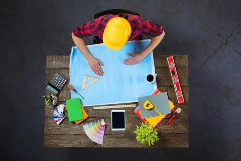 Top view of engineer at wooden table Stock Photos