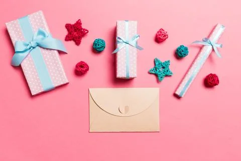 Top view of envelope on pink background. New Year decorations. Christmas holi Stock Photos