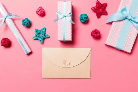 Top view of envelope on pink background. New Year decorations. Christmas holi Stock Photos