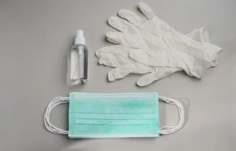 Top view of Epidemic Protective kit, Masks pile, gloves and alcohol hand sani Stock Photos