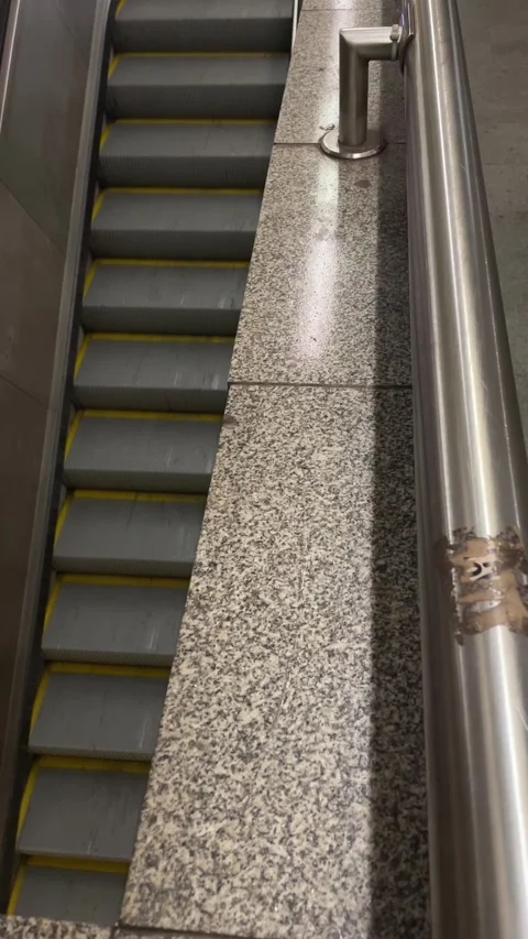 Top view of escalator with safety markings and lighting effects Stock Footage 335368317