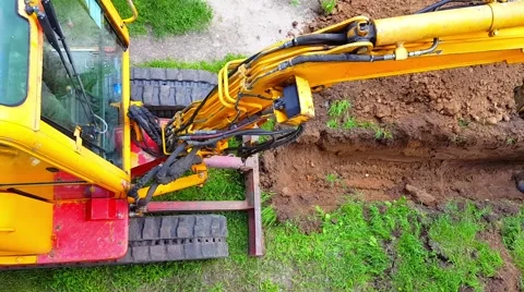 Top view of Excavator digging a trench for laying cables Stock Footage 63781502