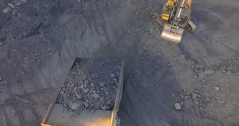 Top view excavator loads coal into dump truck Stock-Footage 122077342