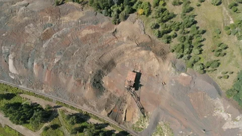 Top view of an excavator mining ore at a quarry Stock Footage 165099763
