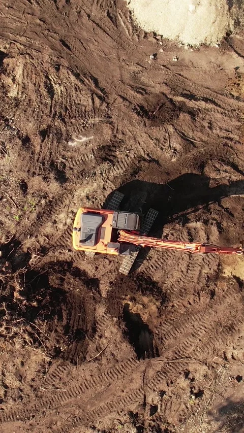 Top View excavator operating on a hillside Stock Footage 336327555