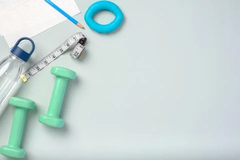 Top view exercise stuff on green purple table for healty lifestyle Stock Photos