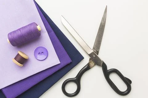 Top view fabrics with notebook thread Stock Photos