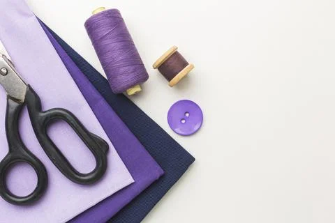 Top view fabrics with notebook thread Stock Photos