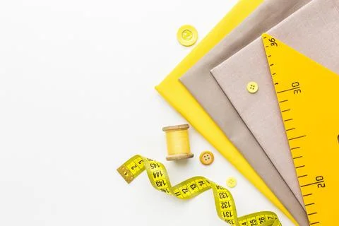 Top view fabrics with notebook thread Stock Photos