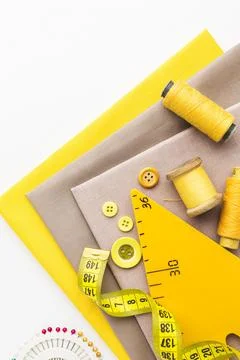 Top view fabrics with notebook thread Stock Photos