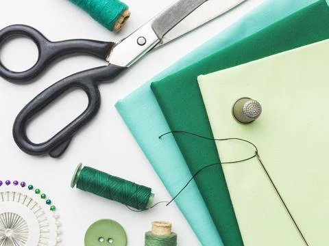 Top view fabrics with notebook thread Stock Photos