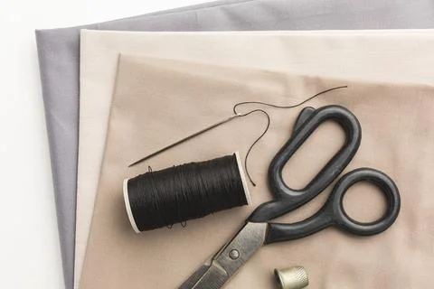 Top view fabrics with scissors thimble. High quality and resolution beautiful Stock Photos