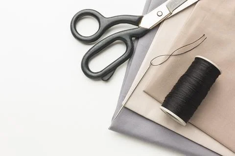 Top view fabrics with scissors thread Stock Photos