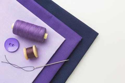 Top view fabrics with thread button Stock Photos