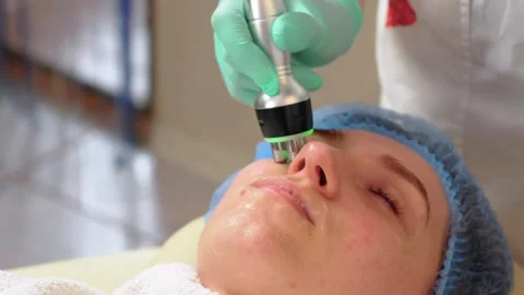 Top view of face of young attractive woman in process of ultrasonic cavitation 스톡 동영상 303716757